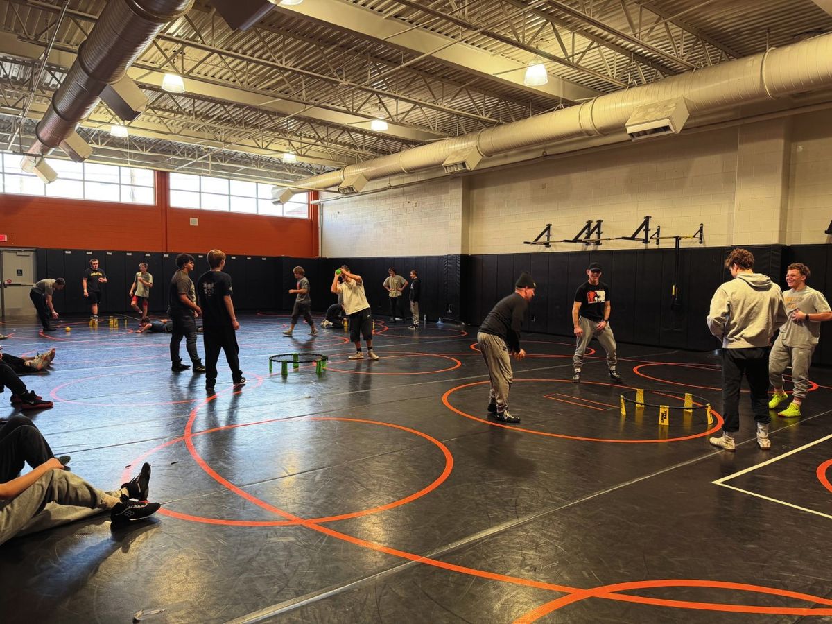 Wrestlers work through a drill in the Northampton wrestling room